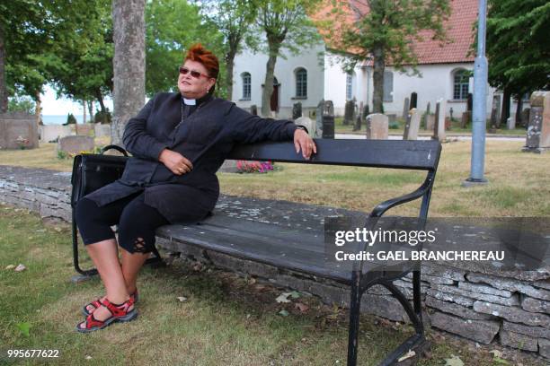 Agneta Soderdahl, priest poses on a bench on Faroe, Sweden, an island in the Baltic sea where Swedish director Ingmar Bergman shot several motion...