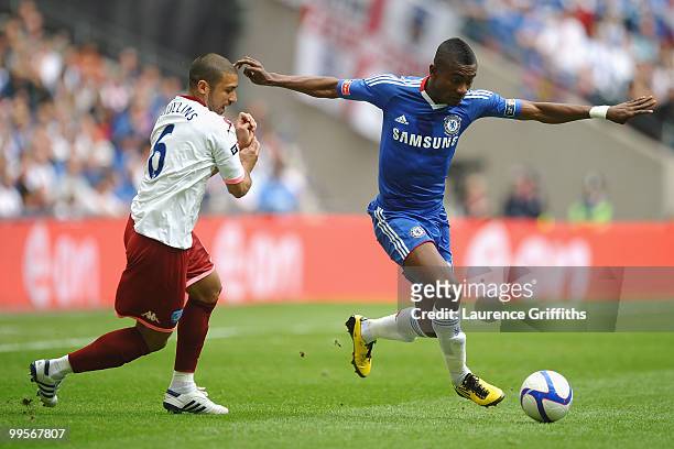Salomon Kalou of Chelsea beats Hayden Mullins of Portsmouth during the FA Cup sponsored by E.ON Final match between Chelsea and Portsmouth at Wembley...
