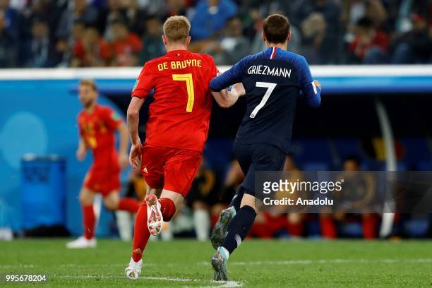 Antoine Griezmann of France and Kevin De Bruyne of Belgium in action during the 2018 FIFA World Cup Russia semi final match between France and...