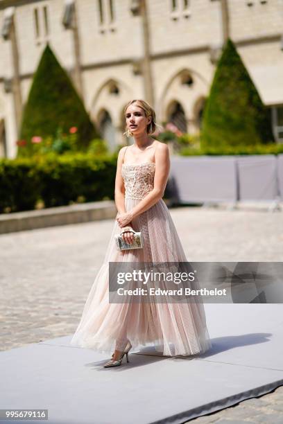 Emma Roberts wears a lace dress , outside Dior, during Paris Fashion Week Haute Couture Fall Winter 2018/2019, on July 2, 2018 in Paris, France.