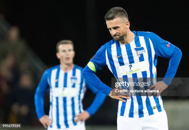 Hertha's Vladimir Darida and Vedad Ibisevic react to the 1:0 defeat after the Europa League match between Ostersunds FK and Hertha BSC at the...