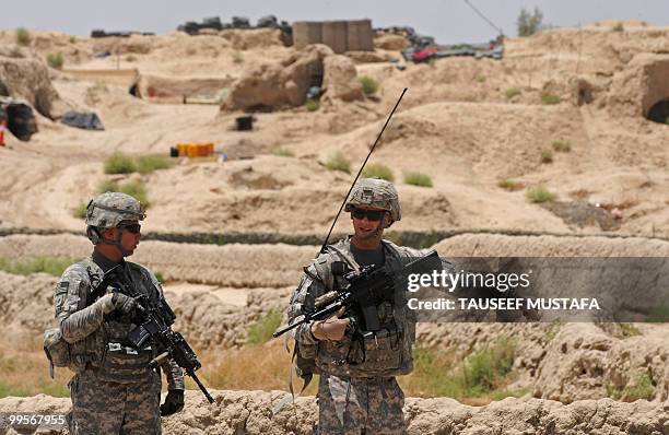 Soldiers from Bravo Troop 1-71 CAV patrol near Belanday village, Dand district in Kandahar on May 15, 2010. NATO and the United States are deploying...