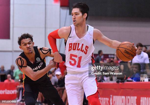 Ryan Arcidiacono of the Chicago Bulls drives against Trae Young of the Atlanta Hawks during the 2018 NBA Summer League at the Cox Pavilion on July...