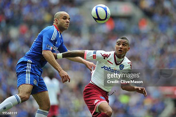 Alex of Chelsea competes for the ball with Kevin-Prince Boateng of Portsmouth during the FA Cup sponsored by E.ON Final match between Chelsea and...