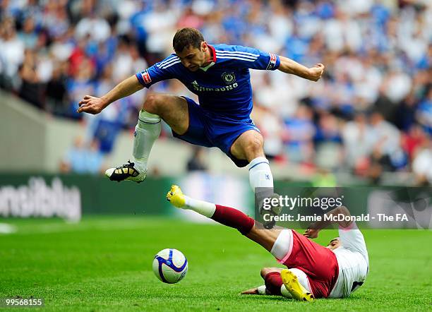 Branislav Ivanovic of Chelsea is challenged by Kevin-Prince Boateng of Portsmouth during the FA Cup sponsored by E.ON Final match between Chelsea and...