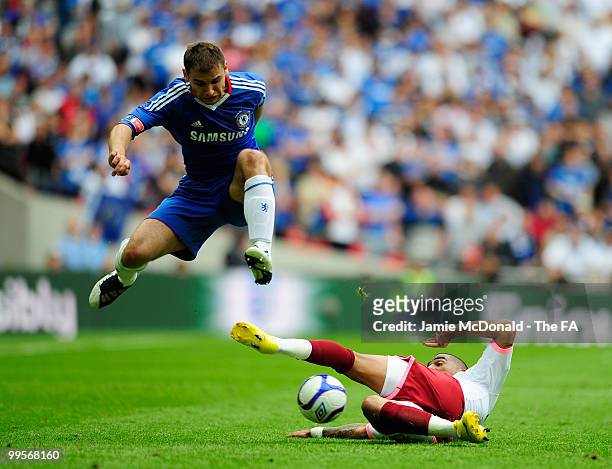 Branislav Ivanovic of Chelsea is challenged by Kevin-Prince Boateng of Portsmouth during the FA Cup sponsored by E.ON Final match between Chelsea and...