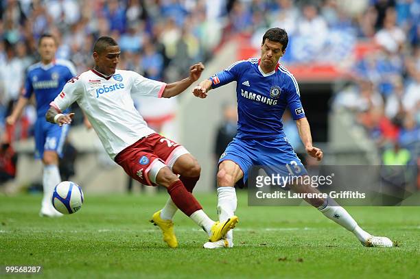 Michael Ballack of Chelsea is tackled and fouled by Kevin Prince Boateng of Portsmouth during the FA Cup sponsored by E.ON Final match between...