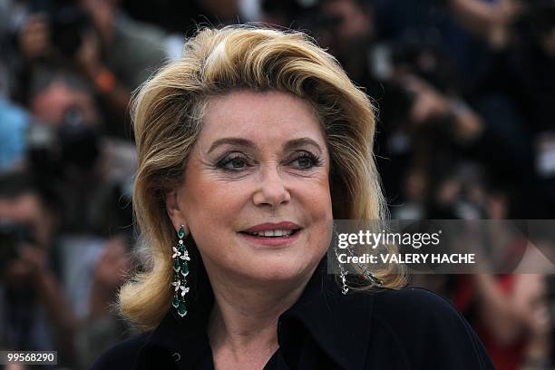 French actress Catherine Deneuve poses during the photocall in homage to Spanish cinema at the 63rd Cannes Film Festival on May 15, 2010 in Cannes....