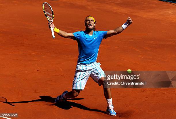 Rafael Nadal of Spain celebrates match point against Nicolas Almagro of Spain in their semi final match during the Mutua Madrilena Madrid Open tennis...