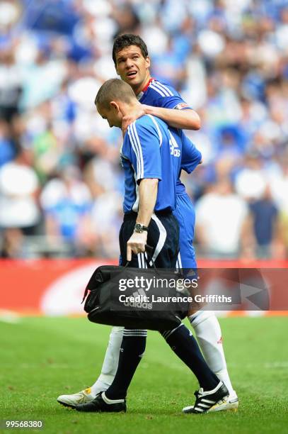 Michael Ballack of Chelsea is attended to by medical staff after being tackled and fouled by Kevin Prince Boateng of Portsmouth during the FA Cup...