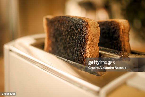 burned bread (bad mornigs deserve a second chance) - toaster stock pictures, royalty-free photos & images