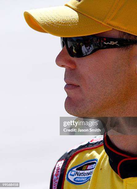 Kevin Harvick, driver of the Ollie's Bargain Outlet Chevrolet, stands on the grid during qualifying for the NASCAR Nationwide Series Heluva Good 200...