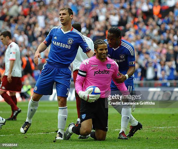 Didier Drogba of Chelsea has a word with goalkeepr David James of Portsmouth during the FA Cup sponsored by E.ON Final match between Chelsea and...