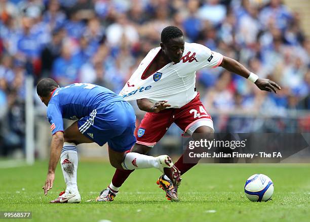 Aruna Dindane of Portsmouth escapes the challenge of Ashley Cole of Chelsea during the FA Cup sponsored by E.ON Final match between Chelsea and...