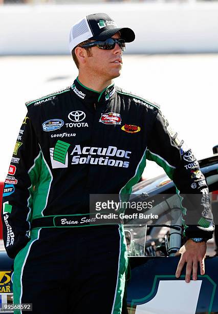 Brian Scott, driver of the Braun Racing Toyota, stands on the grid during qualifying for the NASCAR Nationwide Series Heluva Good 200 at Dover...