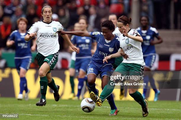 Genoveva Anonma of Jena is challenged by Annemieke Kiesel and Jennifer Oster of Duisburg during the DFB Women's Cup final match between FCR 2001...