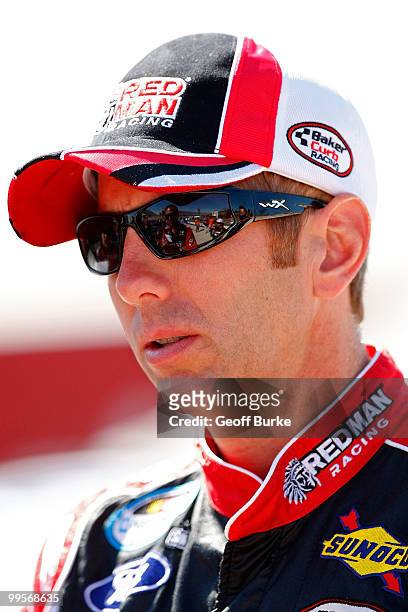 Greg Biffle, driver of the Red Man Moist Snuff Ford, stands on the grid during qualifying for the NASCAR Nationwide Series Heluva Good 200 at Dover...