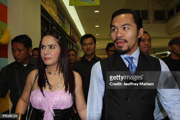 World welterweight boxing champion Manny Pacquiao and wife Jinkee Pacquiao arrive at the KCC Mall on May 15, 2010 in General Santos, Philippines....