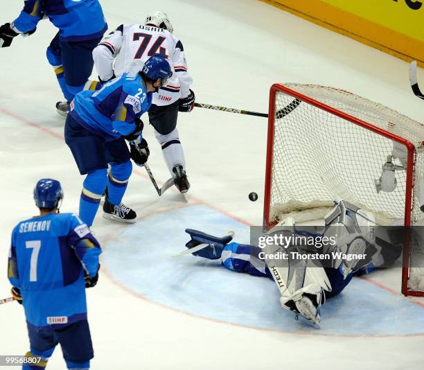 Oshie of United States battles for the puck with Andrei Spiridonov and Alexei Kuzentsov of Kazakhstan during the IIHF World Championship final round...