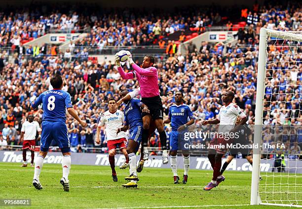 David James of Portsmouth claims the ball under pressure from Salomon Kalou of Chelsea during the FA Cup sponsored by E.ON Final match between...