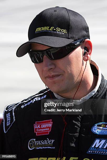 Michael McDowell, driver of the MOBILE-Shop Dodge, stands on the grid during qualifying for the NASCAR Nationwide Series Heluva Good 200 at Dover...