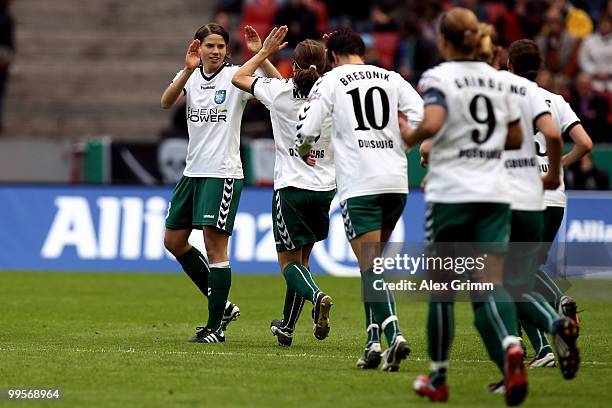 Annike Krahn of Duisburg celebrates her team's first goal with team mates during the DFB Women's Cup final match between FCR 2001 Duisburg and FF USV...