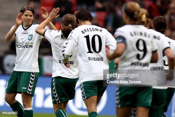 Annike Krahn of Duisburg celebrates her team's first goal with team mates during the DFB Women's Cup final match between FCR 2001 Duisburg and FF USV...