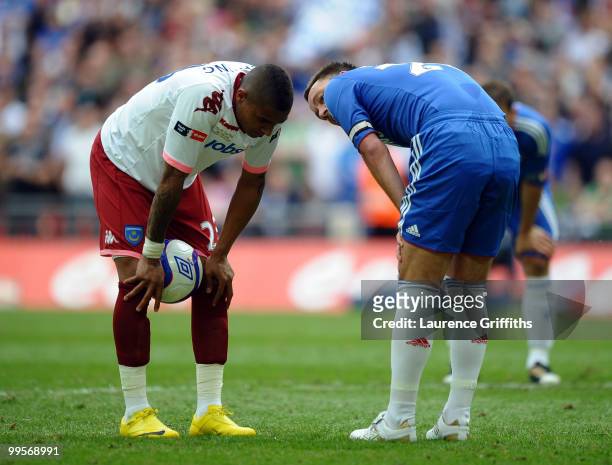 John Terry of Chelsea has words to Kevin Prince Boateng of Portsmouth before he takes a penalty during the FA Cup sponsored by E.ON Final match...