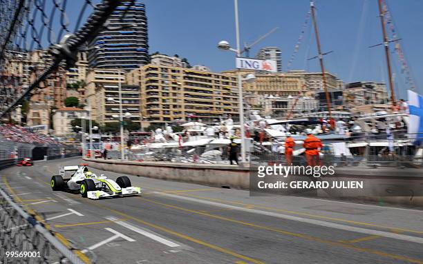 Brawn GP's British driver Jenson Button drives ahead of Ferrari Brazilian's driver Felipe Massa at the Monaco racetrack on May 24, 2009 in Monte...