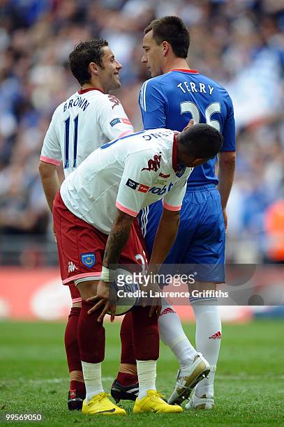 John Terry of Chelsea has words to Michael Brown of Portsmouth before Kevin Prince Boateng of Portsmouth takes a penalty during the FA Cup sponsored...