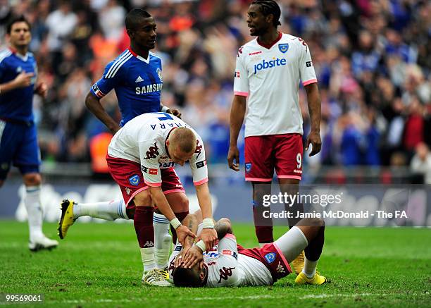 Jamie O'Hara of Portsmouth consoles his team-mate Kevin-Prince Boateng following his penalty being saved by Petr Cech of Chelsea during the FA Cup...