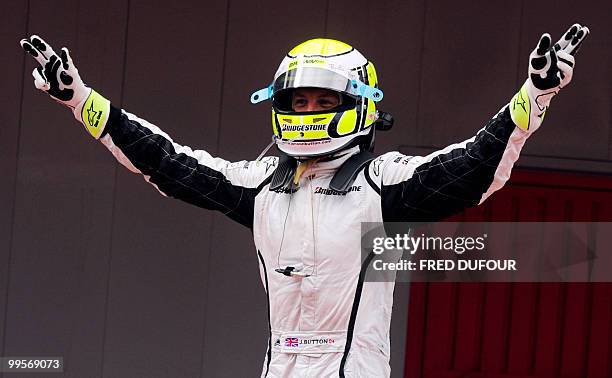 Brawn GP's British driver Jenson Button celebrates in the parc ferme of the Circuit de Catalunya, on May 10, 2009 in Montmelo, near Barcelona, after...
