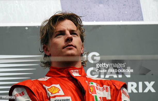 Ferrari's Finnish driver Kimi Raikkonen stands on the podium of the Spa-Francorchamps Circuit on August 30, 2009 in Francorchamps, after the Formula...