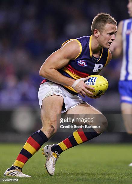 Brent Reilly of the Crows runs with the ball during the round eight AFL match between the North Melbourne Kangaroos and the Adelaide Crows at Etihad...