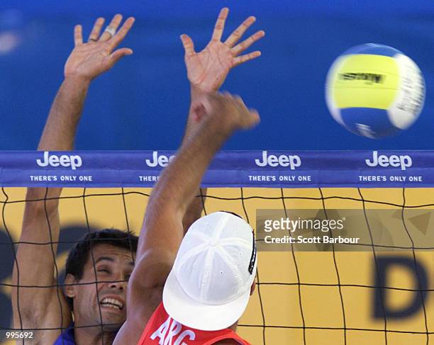 Mathieu Hamel of France attempts to block Martin Conde of Argentina during the mens Beach Volleyball held at the South Bank Piazza at the Goodwill...