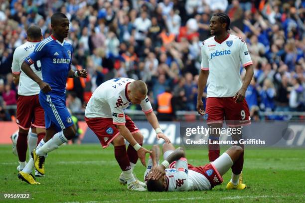 Kevin Prince Boateng of Portsmouth falls to the ground after he takes and misses a penalty during the FA Cup sponsored by E.ON Final match between...