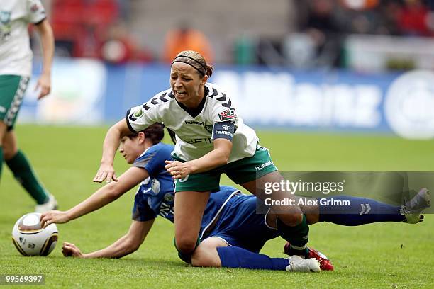 Inka Grings of Duisburg is challenged by Sylvia Arnold of Jena during the DFB Women's Cup final match between FCR 2001 Duisburg and FF USV Jena at...