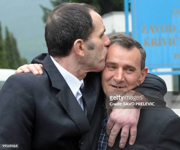Boro Gligic and Spiro Lucic , ex-soldiers of the former Yugoslav army, celebrate after they were sentenced to 18 months in prison, the exact amount...