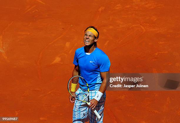 Rafael Nadal of Spain reacts in his semi-final match against his fellow countryman Nicolas Almagro during the Mutua Madrilena Madrid Open tennis...