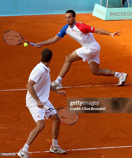 Marcel Granollers of Spain and Viktor Troicki of Serbia in action against Mike Bryan of the USA and Bob Bryan of the USA in their semi final doubles...