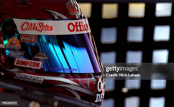 Tony Stewart, driver of the Office Depot Chevrolet, sits in his car in the garage during practice for the NASCAR Sprint Cup Series Autism Speaks 400...