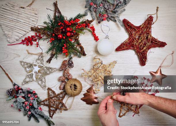 preparing the christmas decoration. - carousel ball stock pictures, royalty-free photos & images