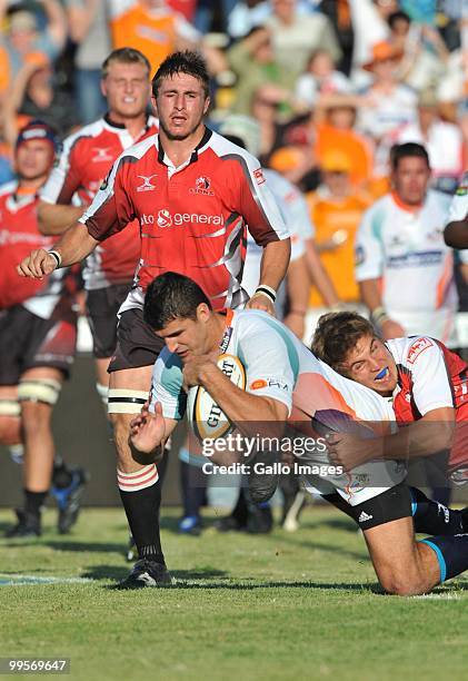 Hennie Daniller of the Cheetahs over for his try with Michael Killian of the Lions too late in the tackle during the Super 14 match between Vodacom...