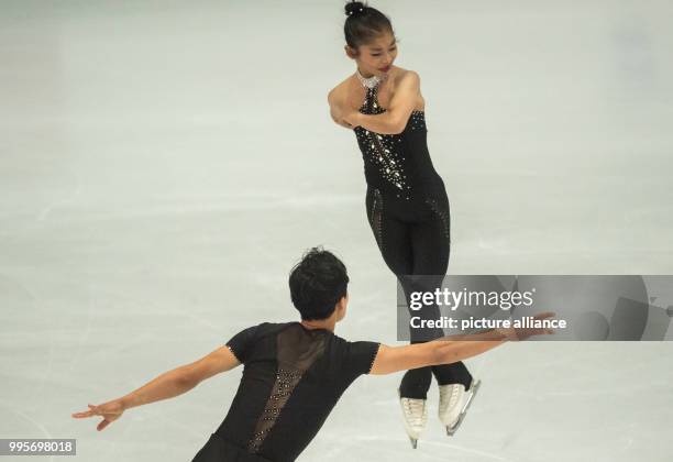 Ryom Tae-ok and Kim Ju-sik of North Korea in action during the free pair skating of the Challenger Series Nebelhorn Trophy figure skating competition...