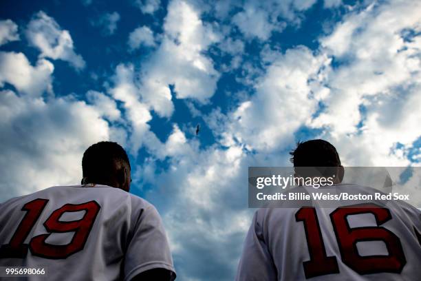 Jackie Bradley Jr. #19 and Andrew Benintendi of the Boston Red Sox look on before a game against the Texas Rangers on July 10, 2018 at Fenway Park in...