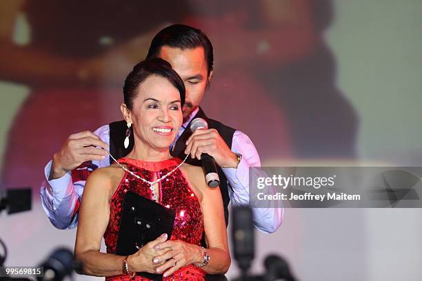 World welterweight boxing champion Manny Pacquiao is seen with his mother Dionisia Pacquiao at the KCC Mall on May 15, 2010 in General Santos,...