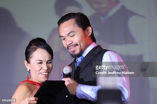 World welterweight boxing champion Manny Pacquiao is seen with his mother Dionisia Pacquiao at the KCC Mall on May 15, 2010 in General Santos,...