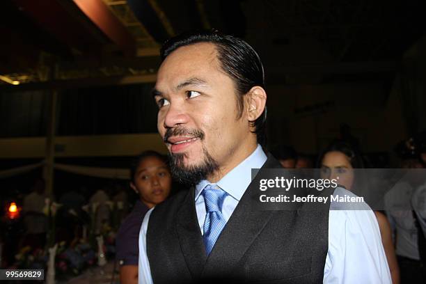 World welterweight boxing champion Manny Pacquiao arrives at the KCC Mall on May 15, 2010 in General Santos, Philippines. Pacquiao was there to...