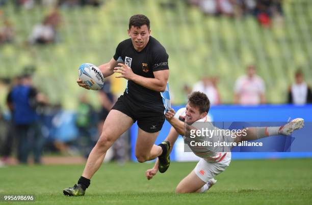 Germany's Jarrod Saul and England's Will Edwards in action during the Oktoberfest 7s international rugby competition England vs Germany in Munich,...