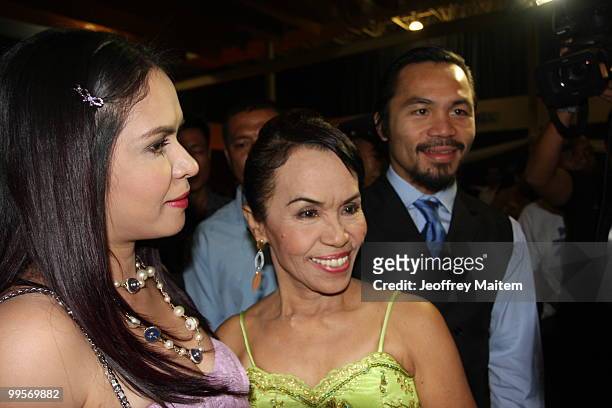 World welterweight boxing champion Manny Pacquiao is seen with his mother Dionisia Pacquiao and wife Jinkee Pacquiao at the KCC Mall on May 15, 2010...